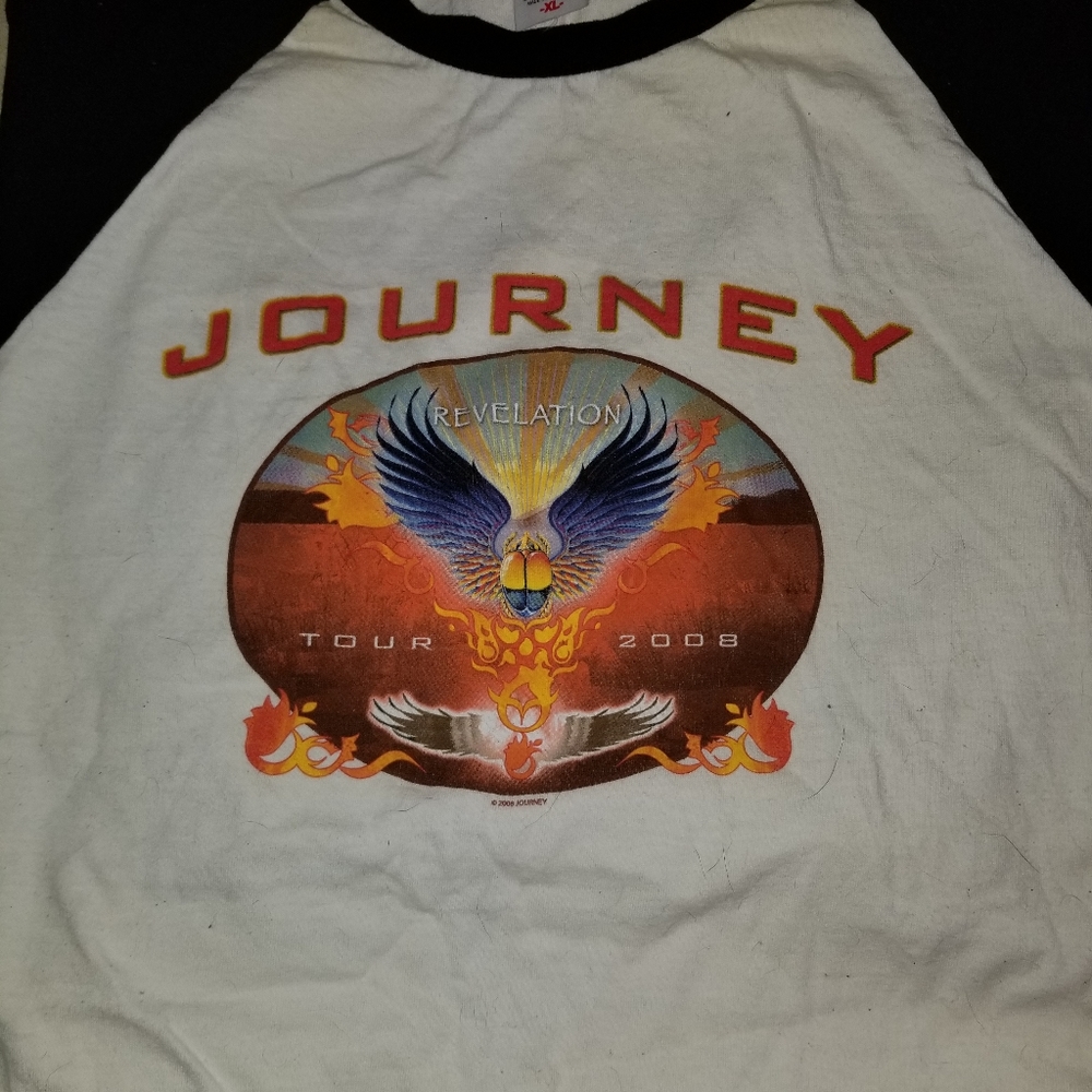 Journey shirt has tag.